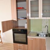 Многоъгълна кухня по поръчка орех и бажов гланц 